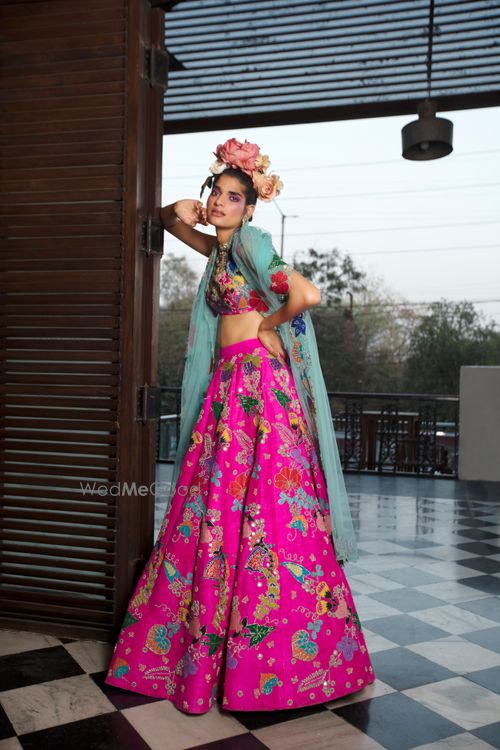 Hot pink jacket and skirt set by Aisha Rao
